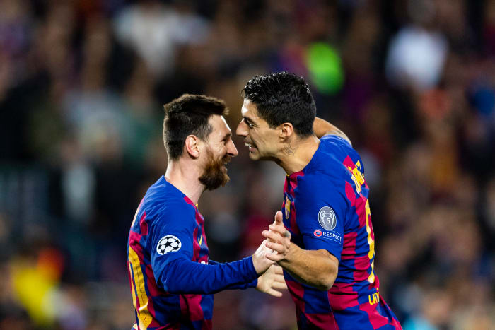 Lionel Messi (left) and Luis Suarez pictured celebrating a goal during Barcelona's win over Dortmund in November 2019